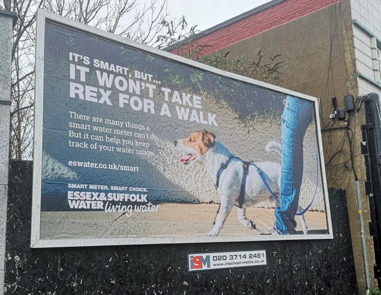 Large-format outdoor billboard advertising in a UK city environment