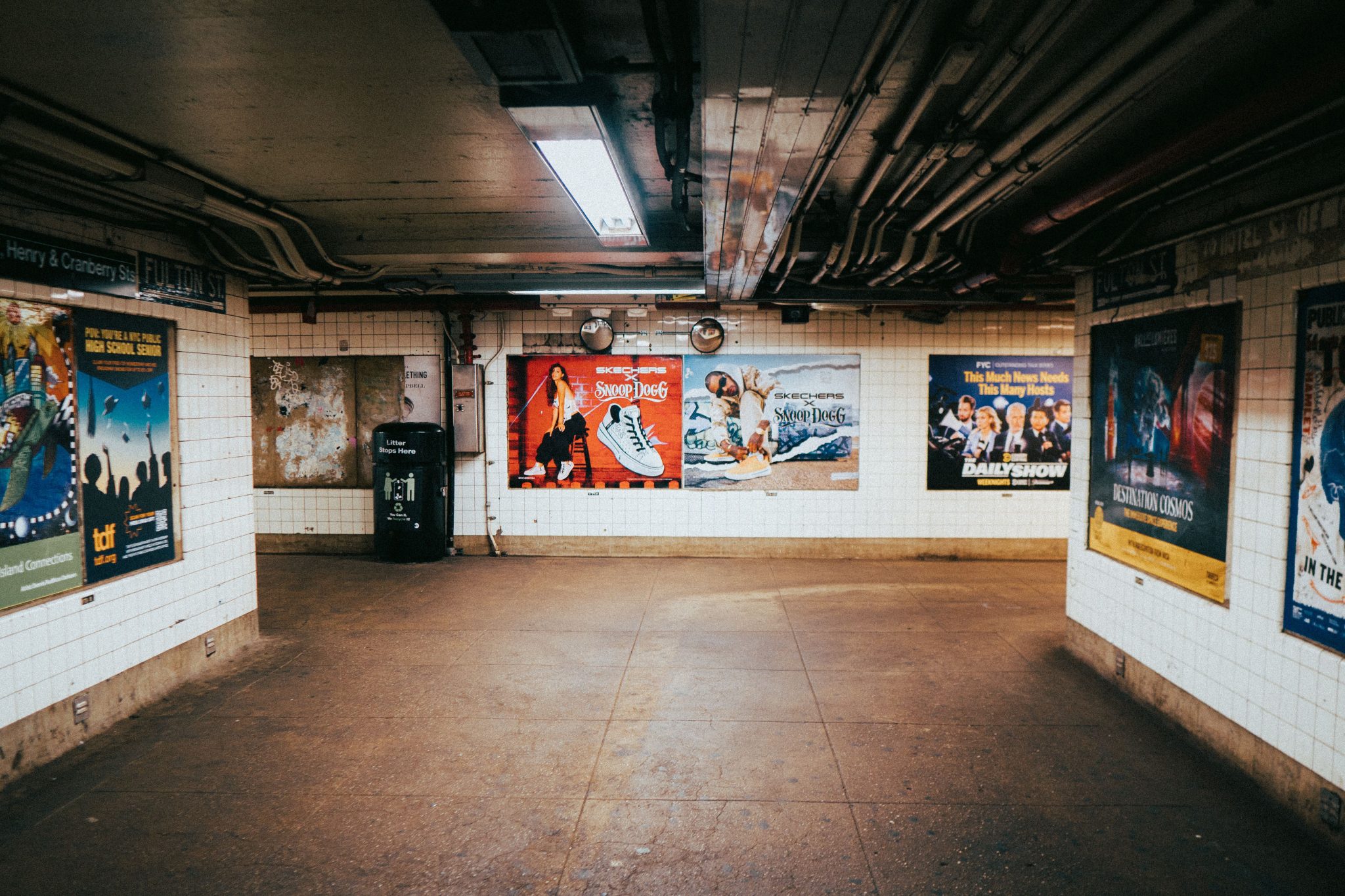 Advertising displays inside a busy city rail station